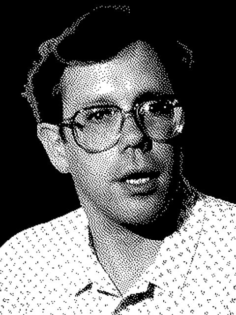Black-and-white halftone-style image of a man with glasses, identified as Bill Atkinson, wearing a collared shirt and looking slightly to the side.