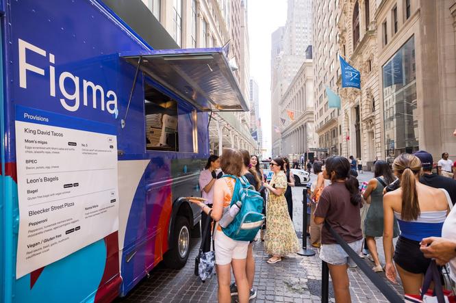 People line up at a Figma-branded food truck offering tacos, bagels, and pizza.