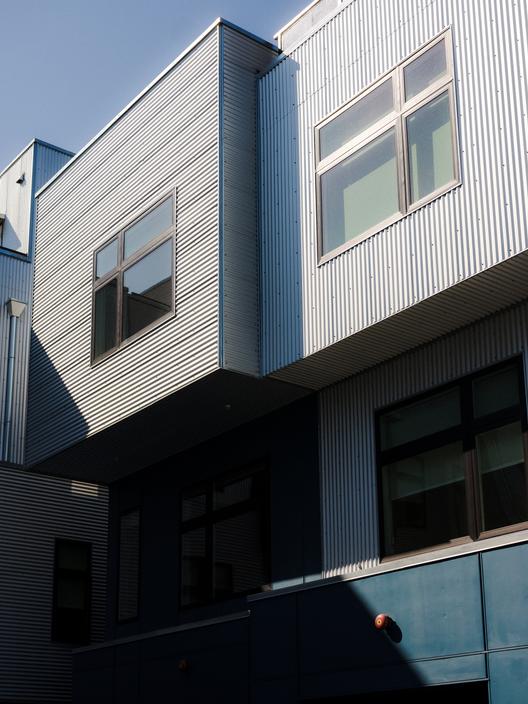 The CROP building is boxy and clad with corrugated metal
