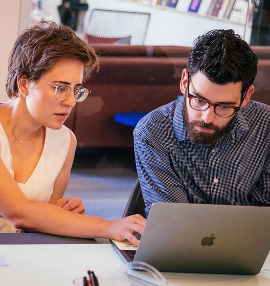 two people working at a computer