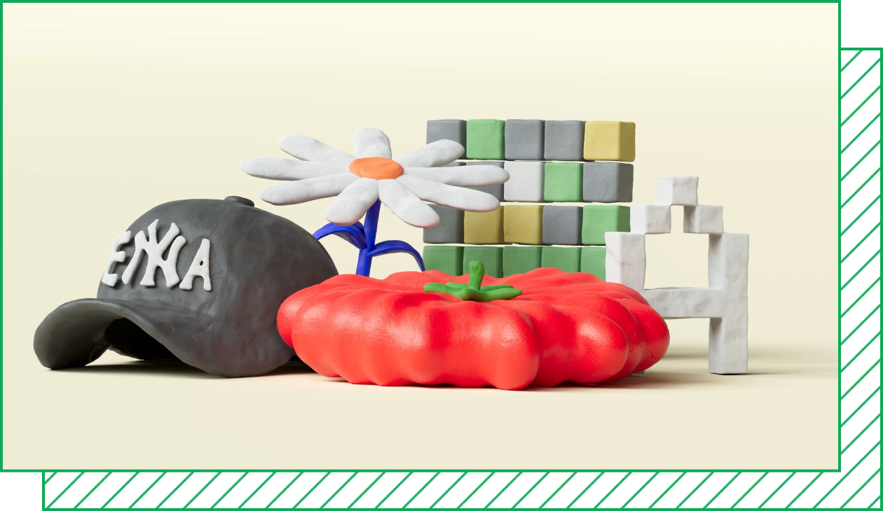 A tableau of clay objects: a baseball cap reading “Enya,” a daisy, a tomato, a Wordle grid, and a pixelated letter A