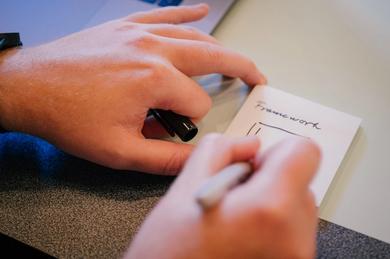 hand writing on a piece of paper that says framework