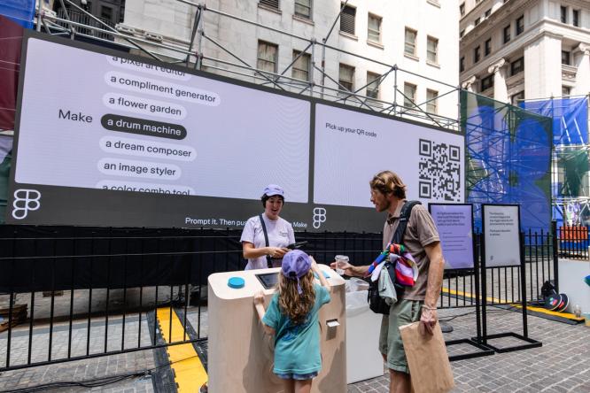 A family interacts with a Make station beneath a screen listing creative project prompts.