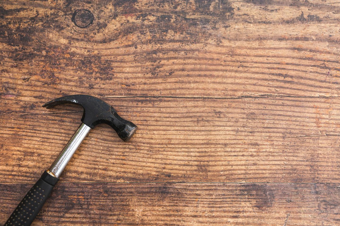 hammer lay on old floorboards