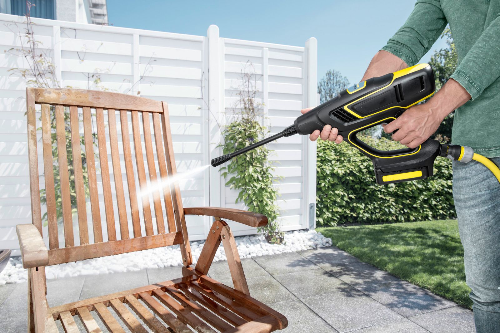 Karcher pressure washer in use cleaning a patio