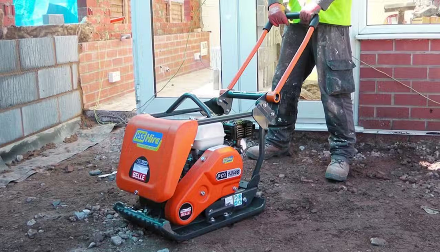 A worker using a wacker plate from HSS
