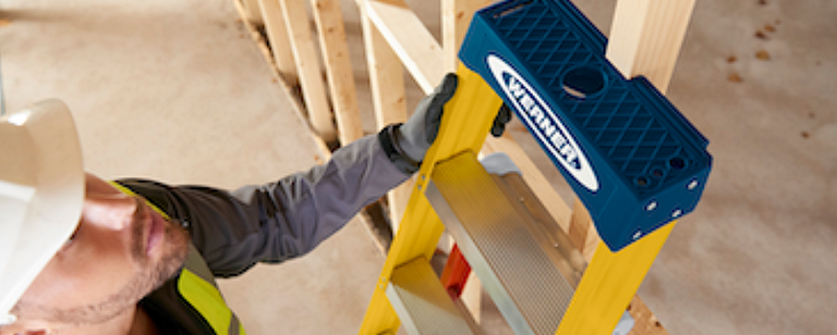 man standing on a Werner ladder