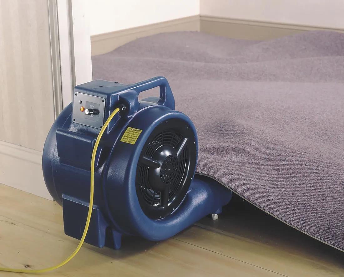 carpet air mover drying a carpet
