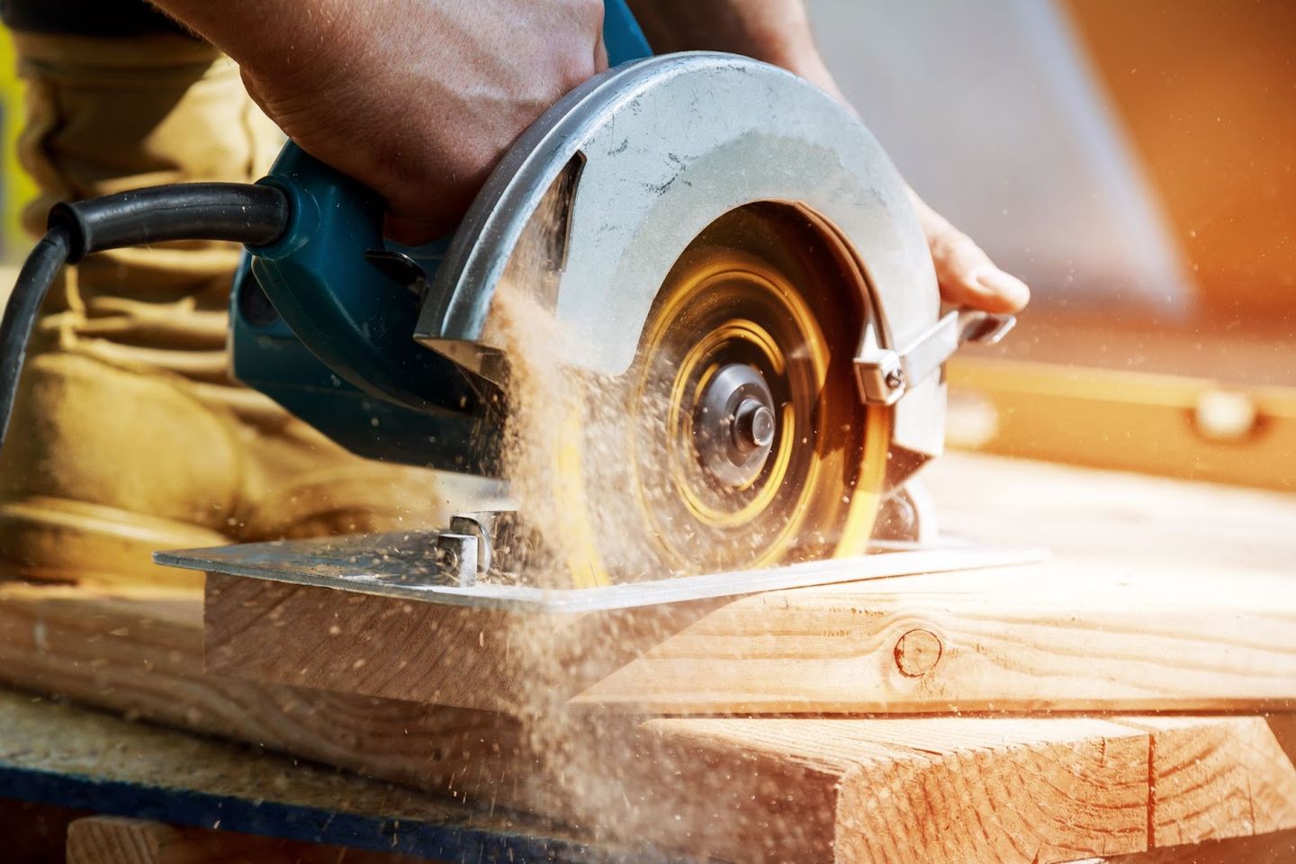 circular saw cutting through wood with sparks
