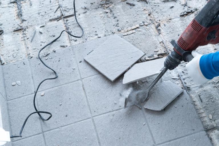 removing tiles using hammer drill with masonry chisel