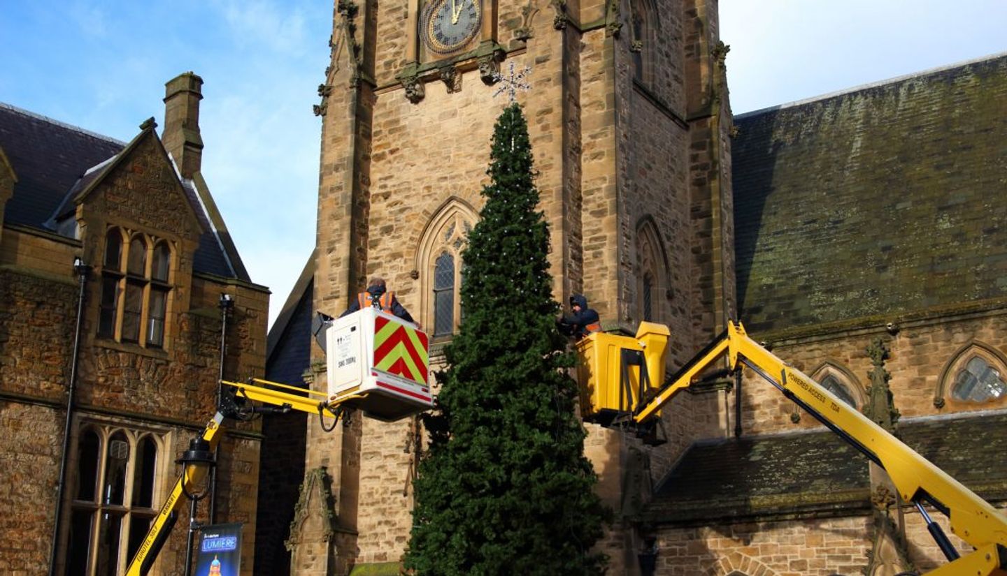 using boomlift to take down the christmas lights