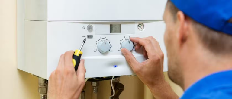 gas engineer setting up a boiler