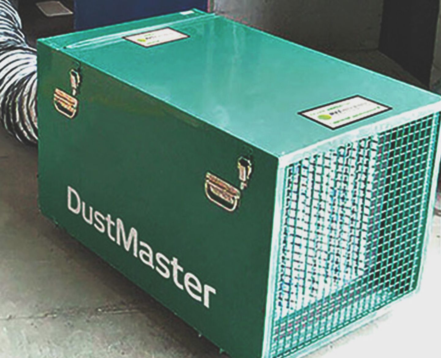 Portable dust extraction unit with flexible ducting, used to control dust on site