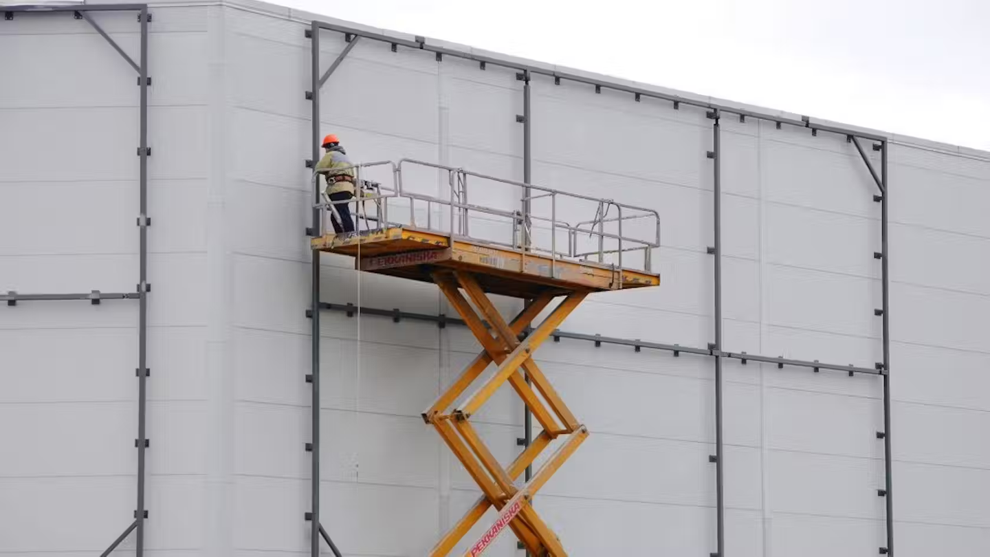 Someone working at height on a construction site.