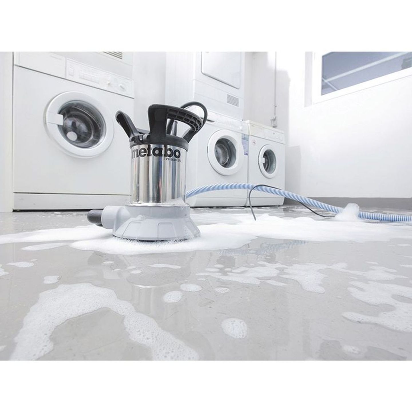 water pump on the flooded laundry room floor