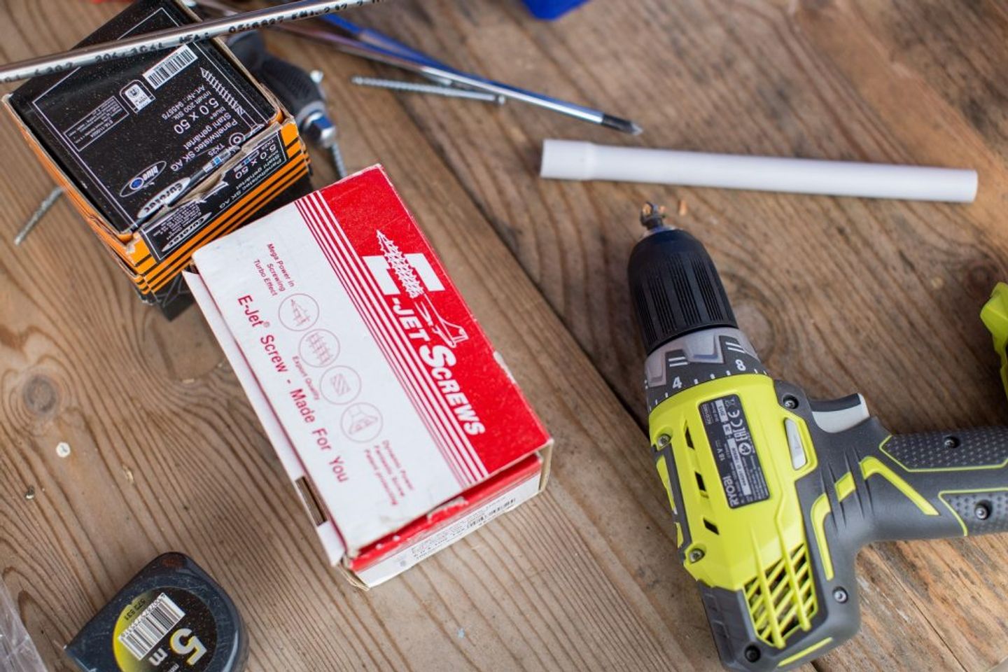 cordless drill and boxes of screws