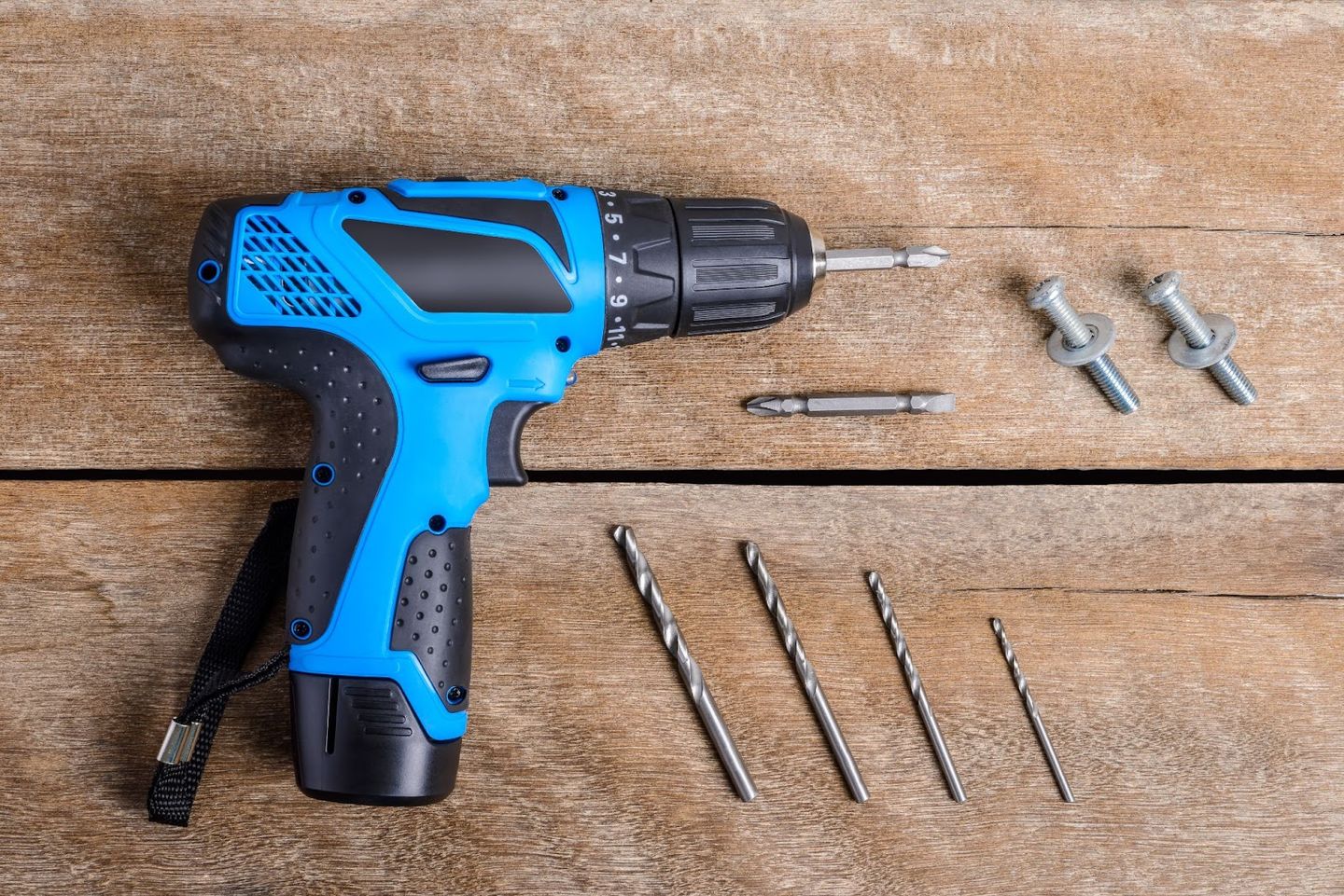 small drill with bits and screws