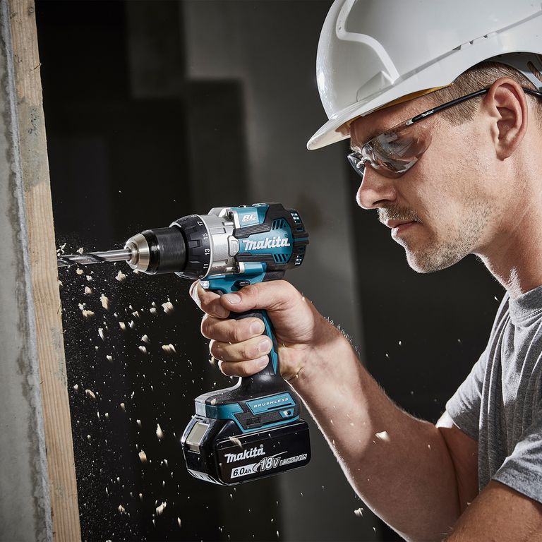 man using makita cordless drill