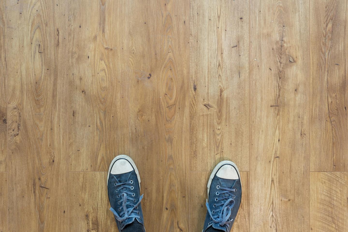 2 feet stood on floorboards