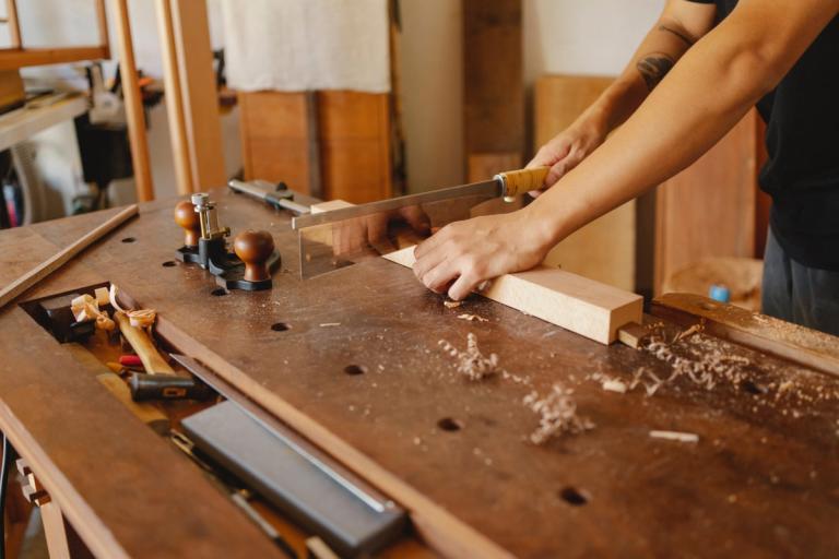 cutting wood with a hand saw