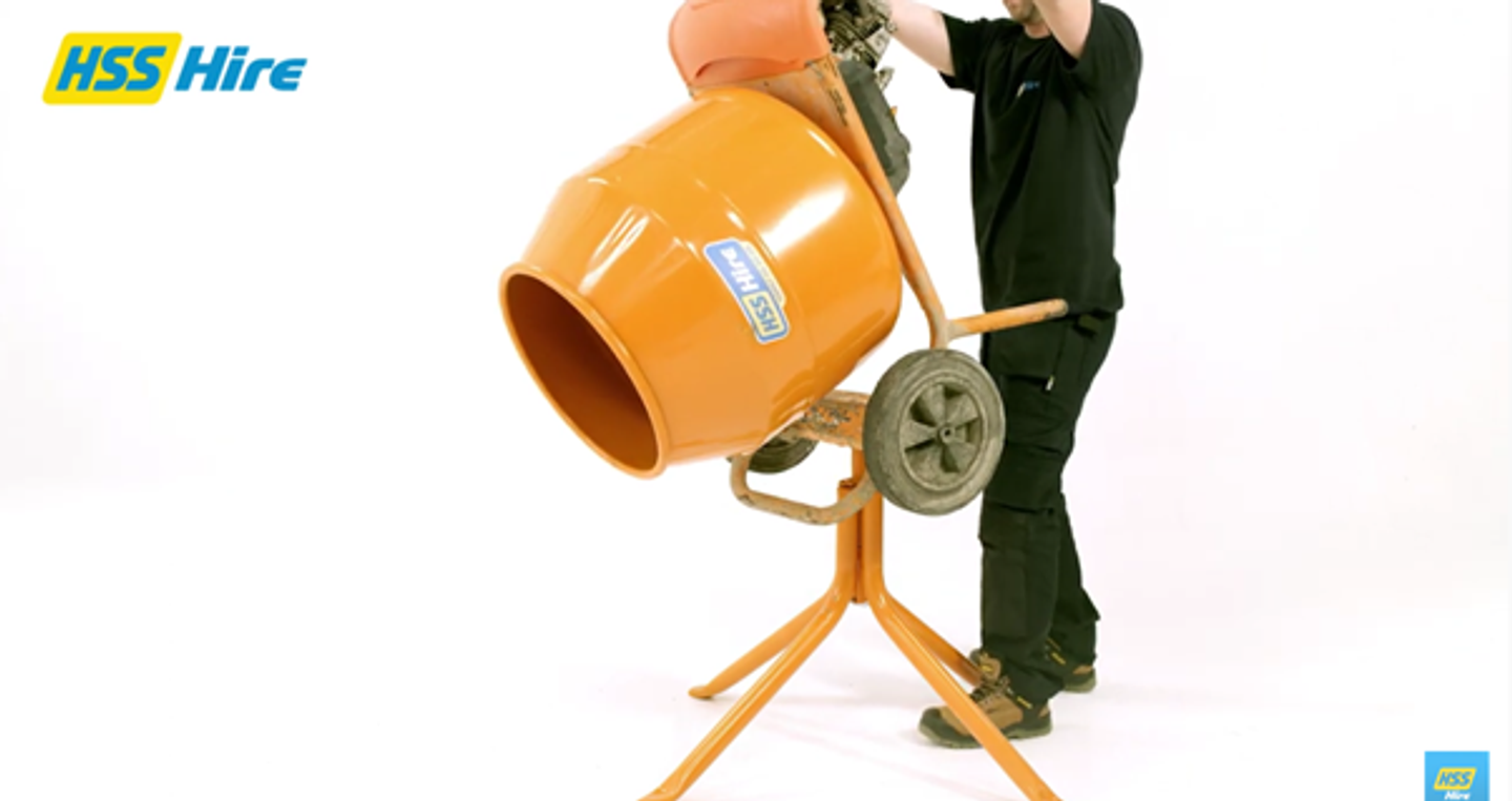 men pouring the concrete from the concrete mixer