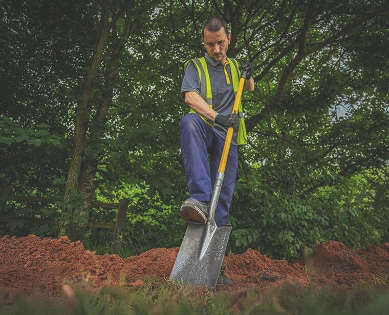 Digging and cultivating a garden border during a bank holiday makeover