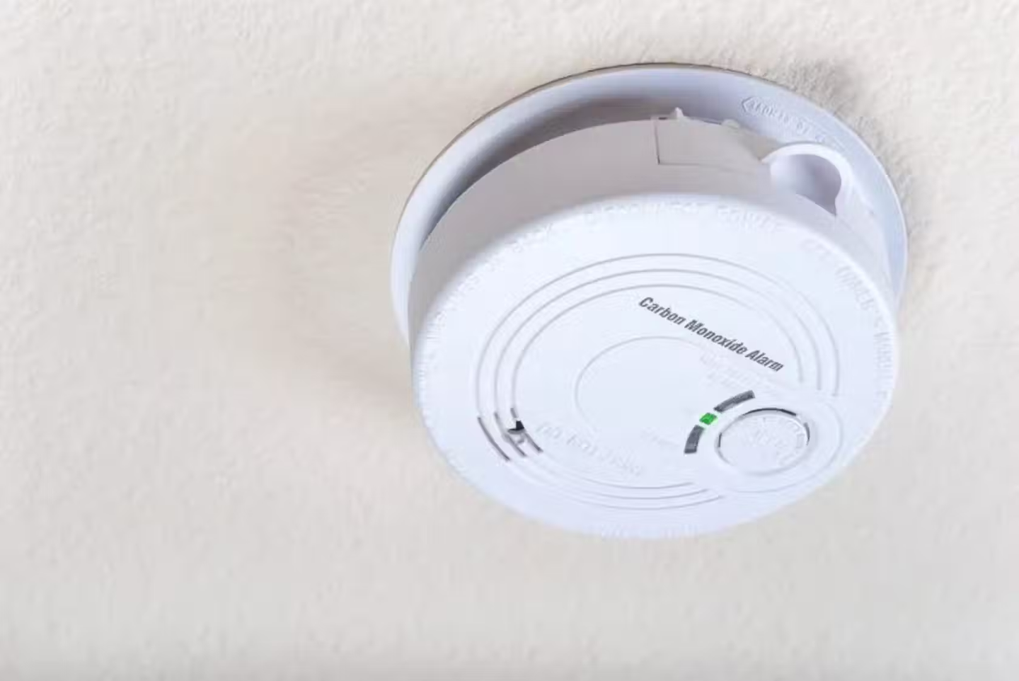 A carbon monoxide alarm on a wall.