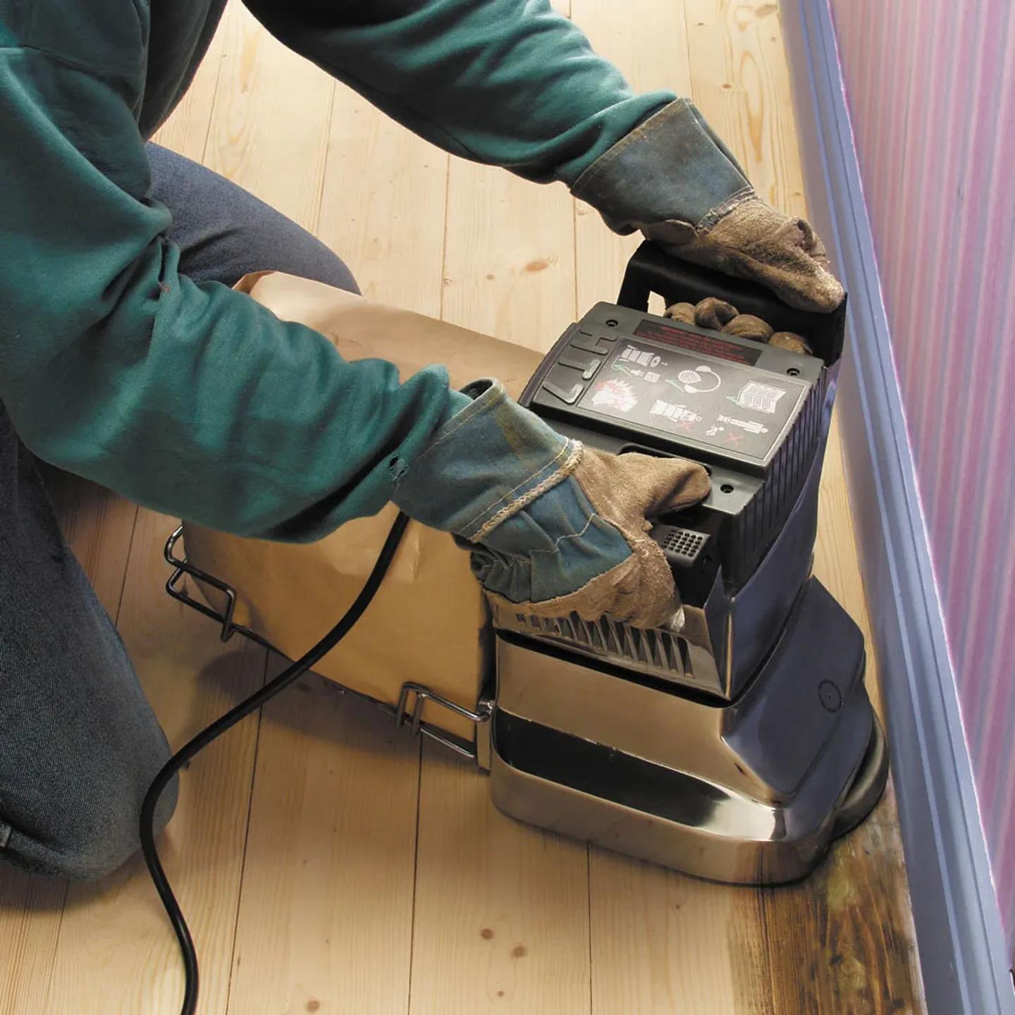 Someone using an edging sander.