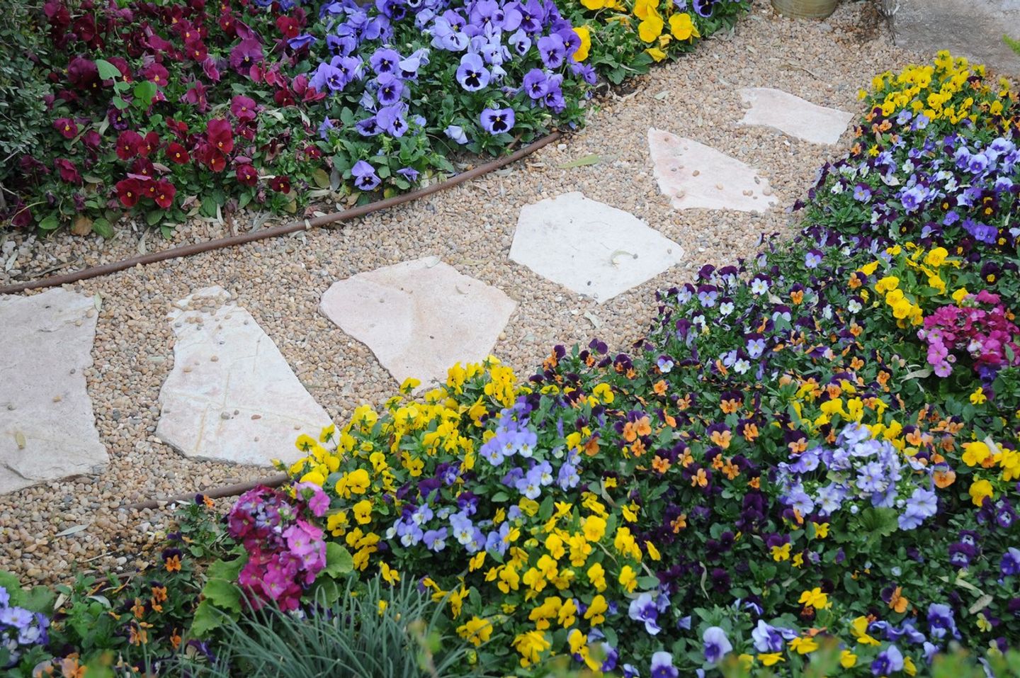 a rock slabs on gravel garden path