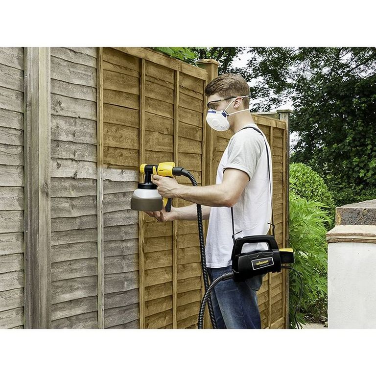 spray painting garden fence