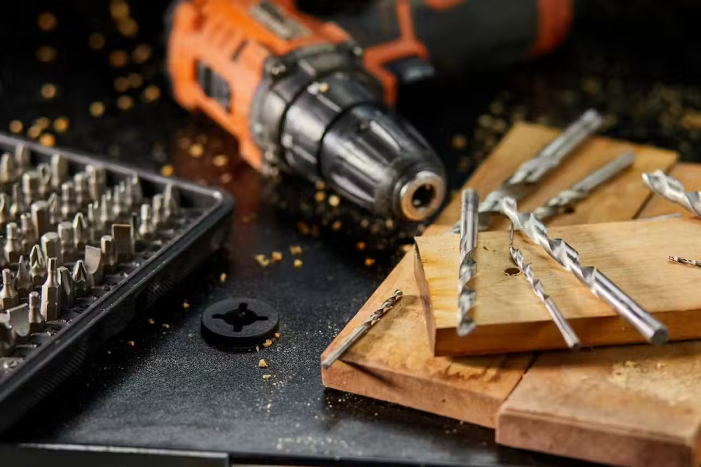 A drill with a range of drill bits