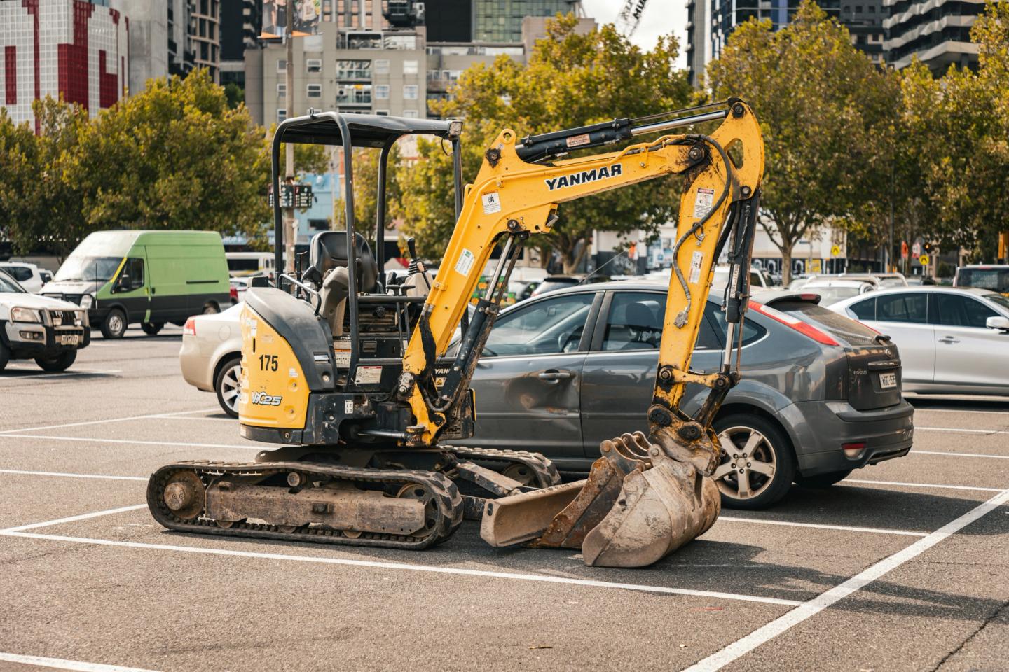 mini digger parked on the car park
