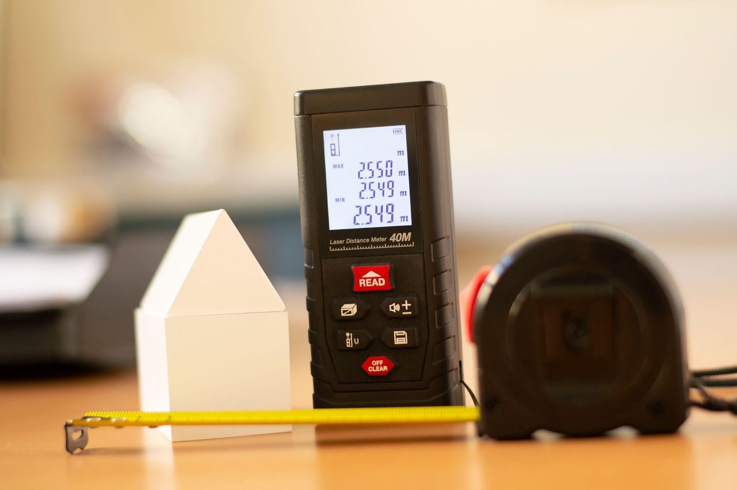 laser tape measure and a retractable tape measure