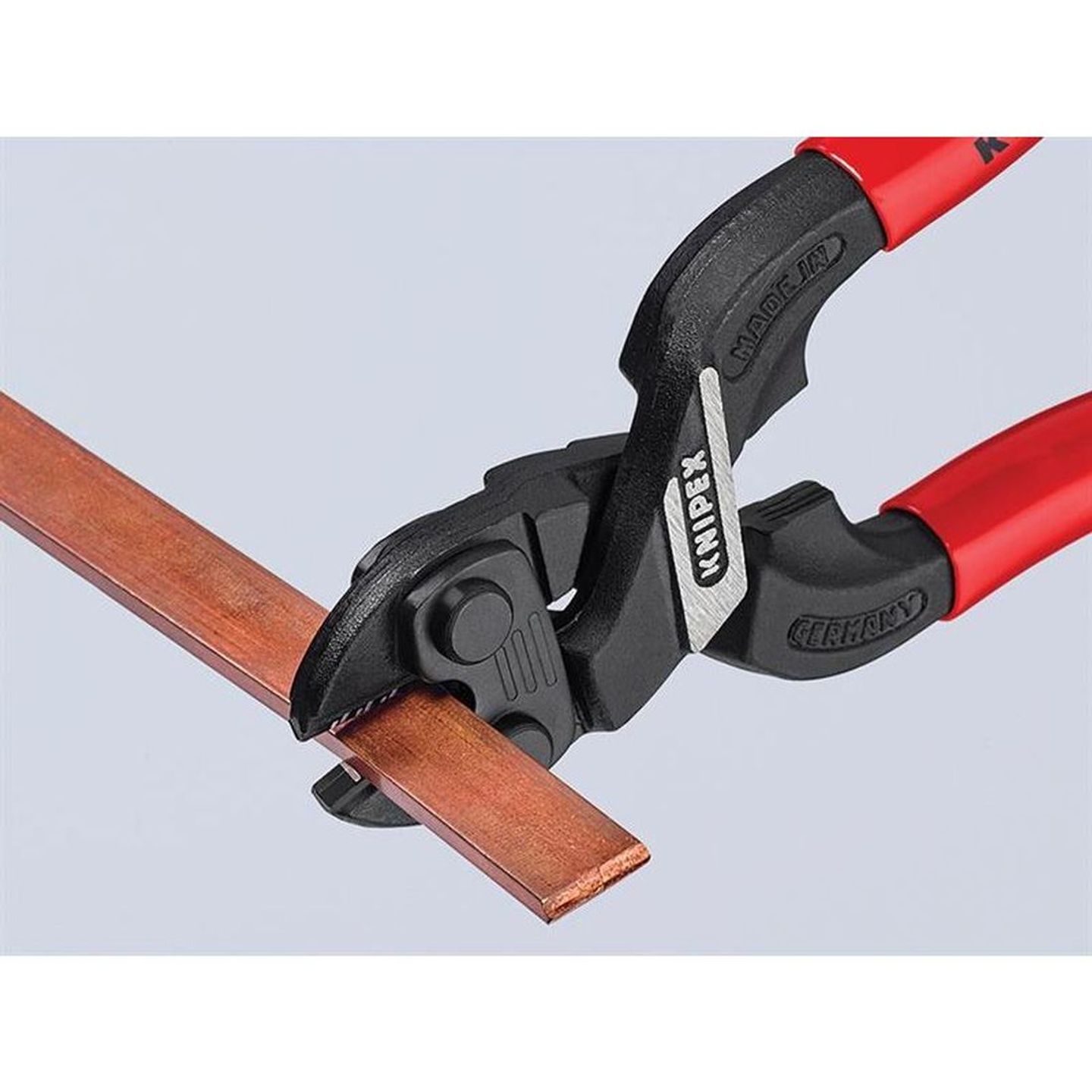 red knipex bolt cutters cutting a piece of metal