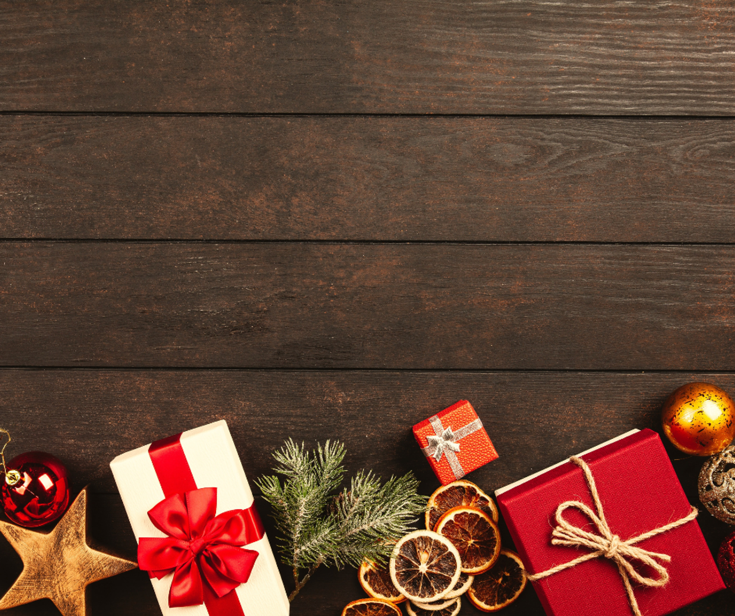 christmas gifts ornaments and decorations on the dark wooden table