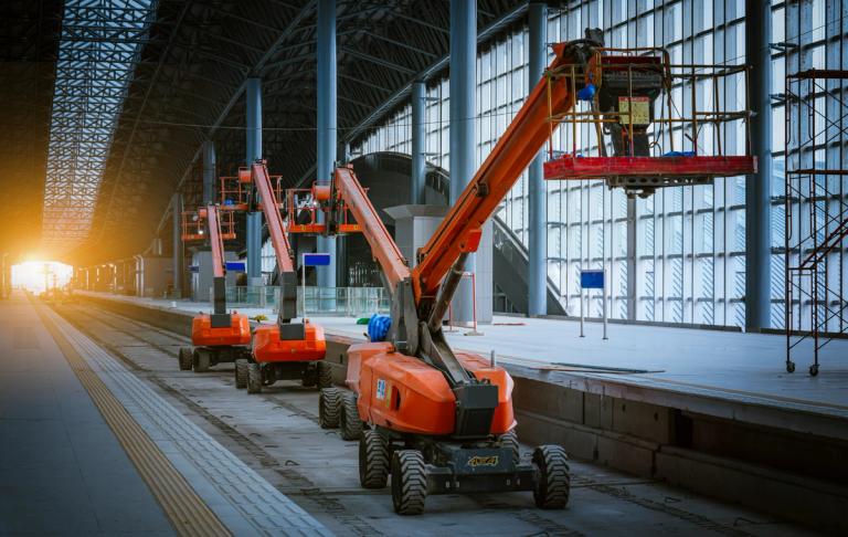 3 boom lifts in a row