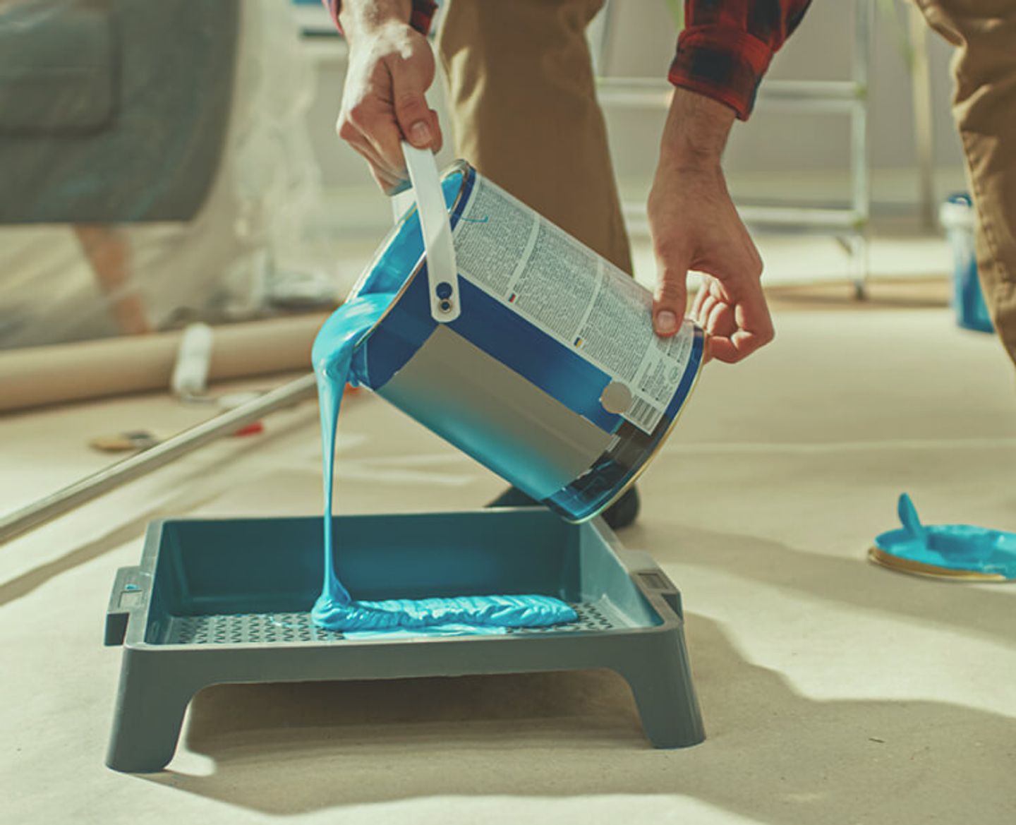 spilling paint off the paint bucket