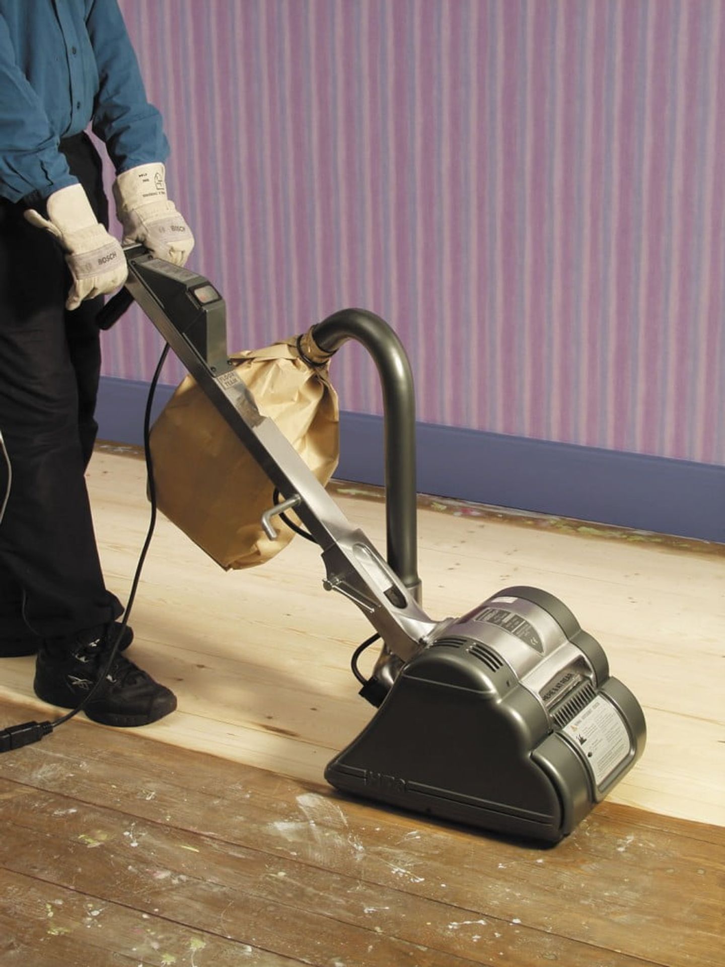 person using floor sander