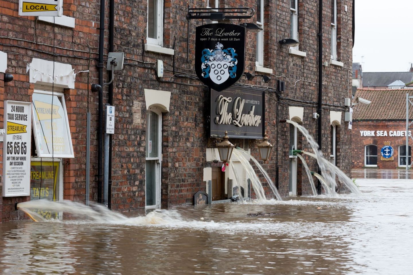Flooded pub businesses houses in a brick buildings in York UK