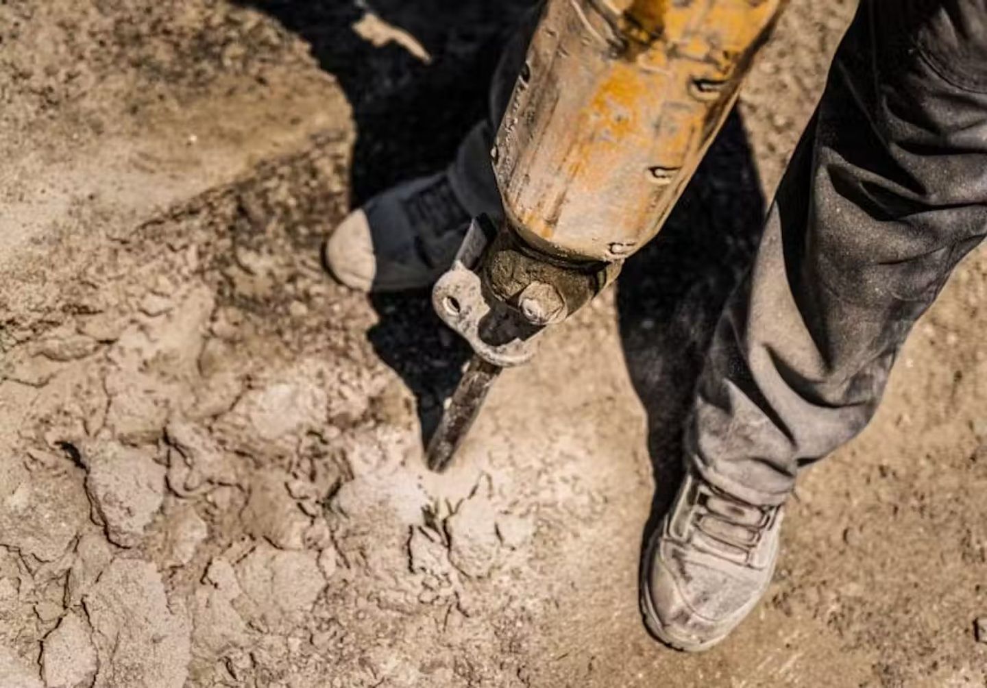breaking concrete with heavy-duty breaker