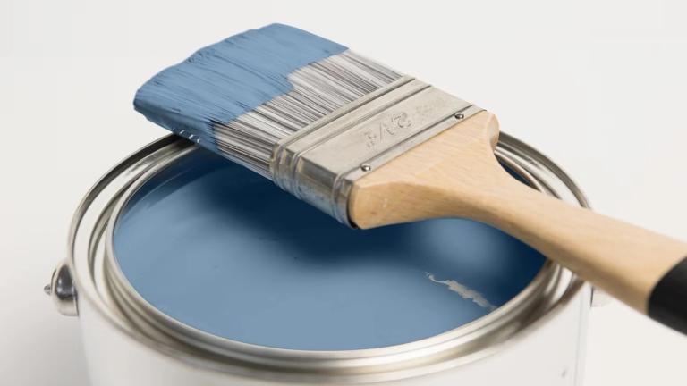 Dulux light blue paint and brush
