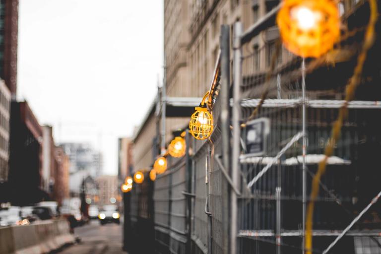 festoon lights on the street scaffolding