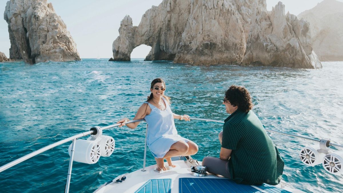Couple Enjoying Yacht Cruise Near Cabo Arch