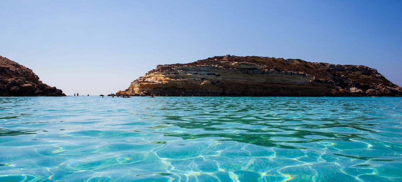 View of the most famous sea place of Lampedusa, It is named Spiaggia dei conigli, in English language Rabbits Beach or Conigli island