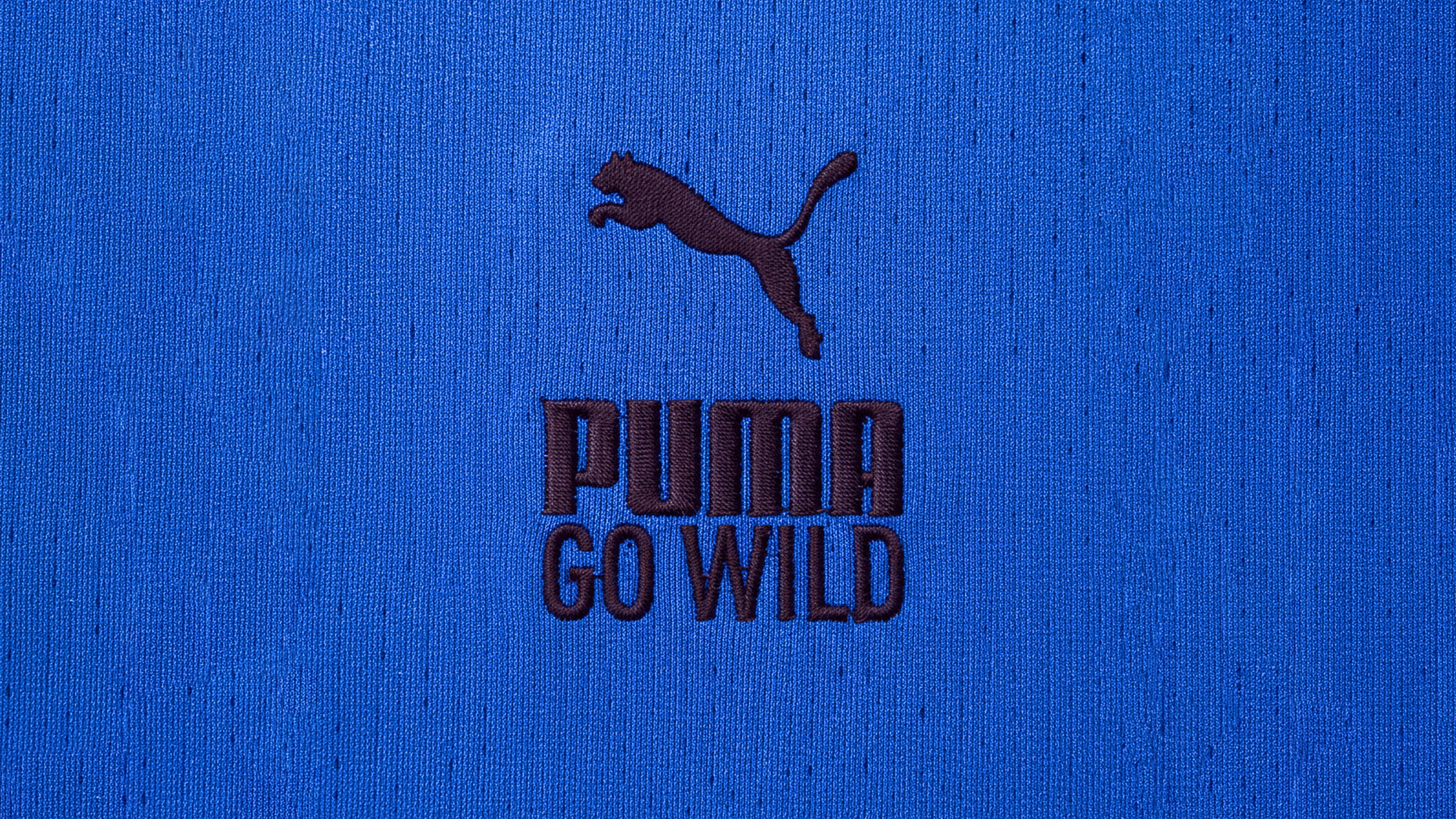 An image of Puma Go Wild logo on a running tee shirt