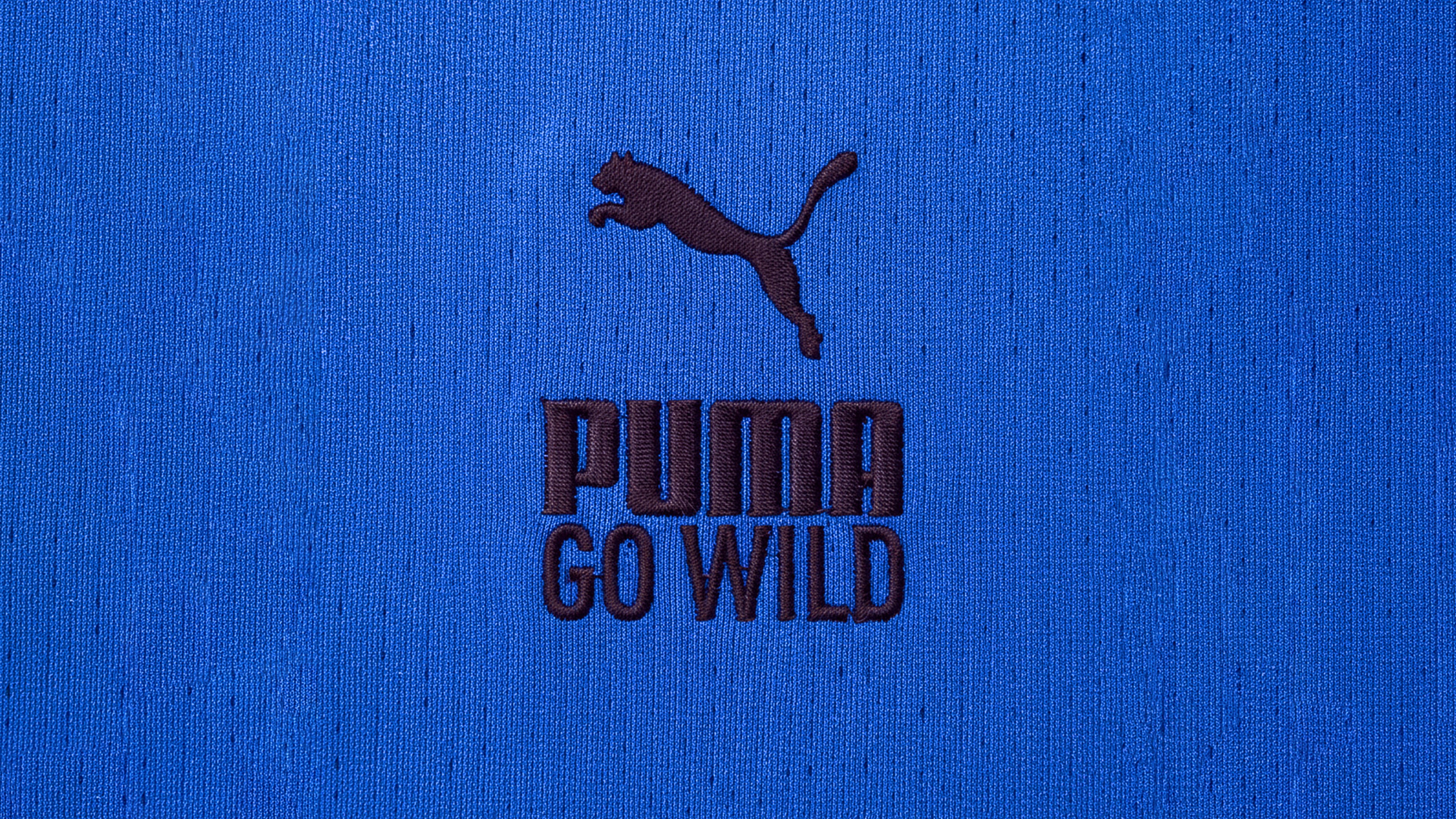 An image of Puma Go Wild logo on a running tee shirt