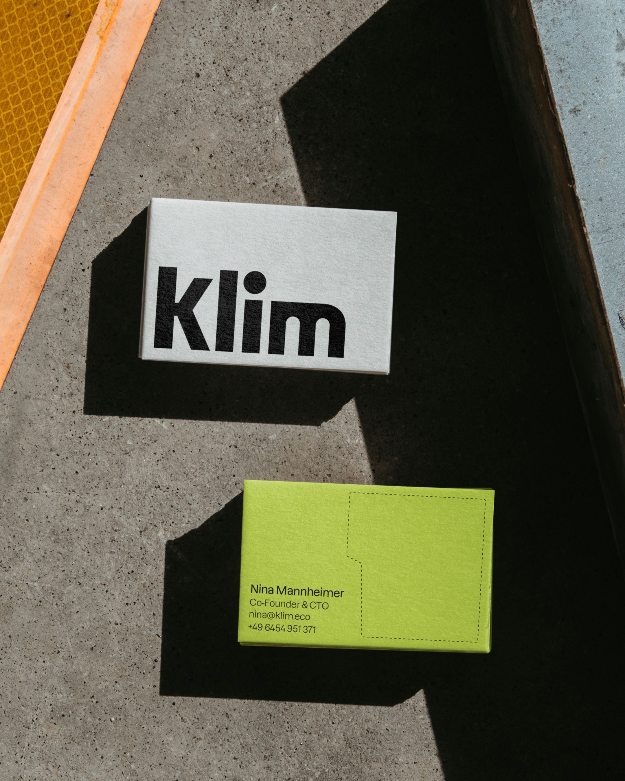 An image of Klim business cards showing the logo and branding