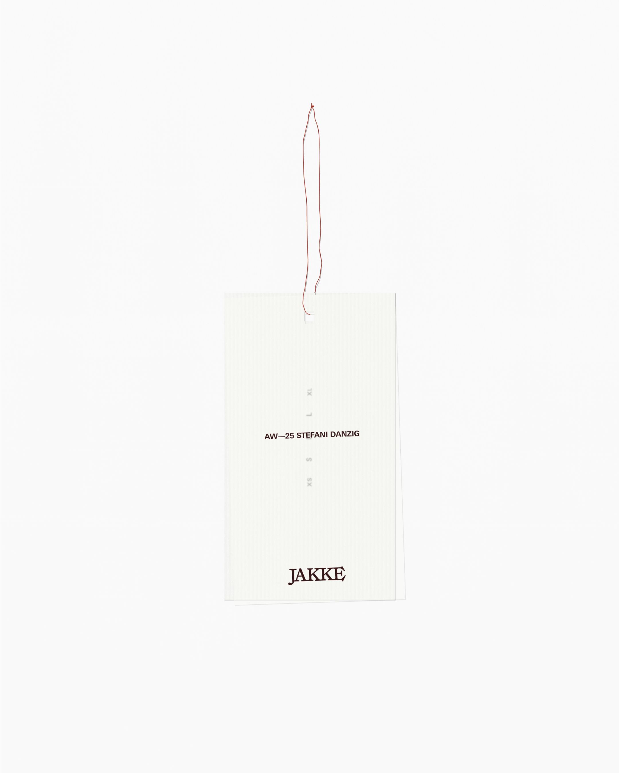 An image of Jake womenswear fashion brand showing the logo design on a swing tag