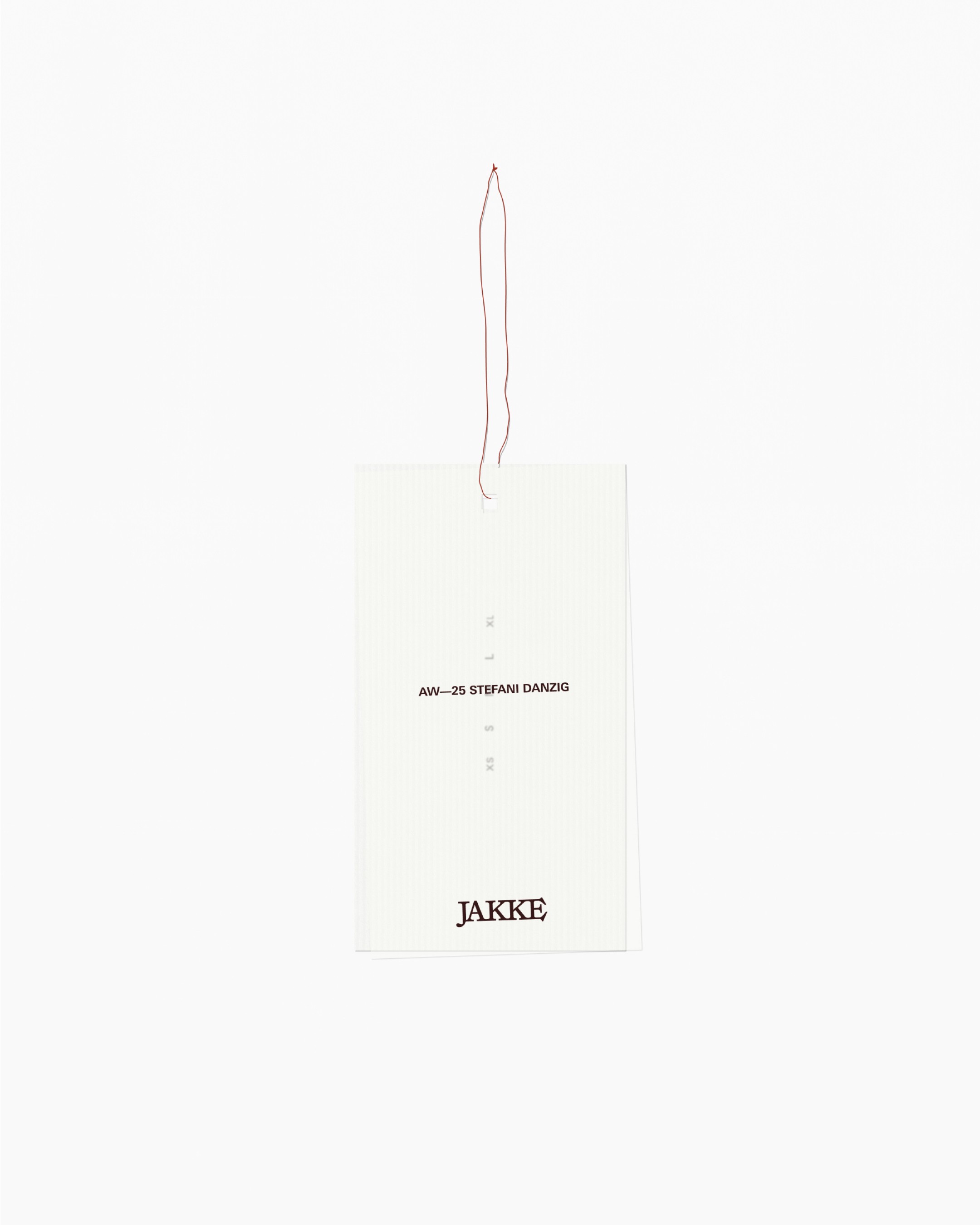 An image of Jake womenswear fashion brand showing the logo design on a swing tag