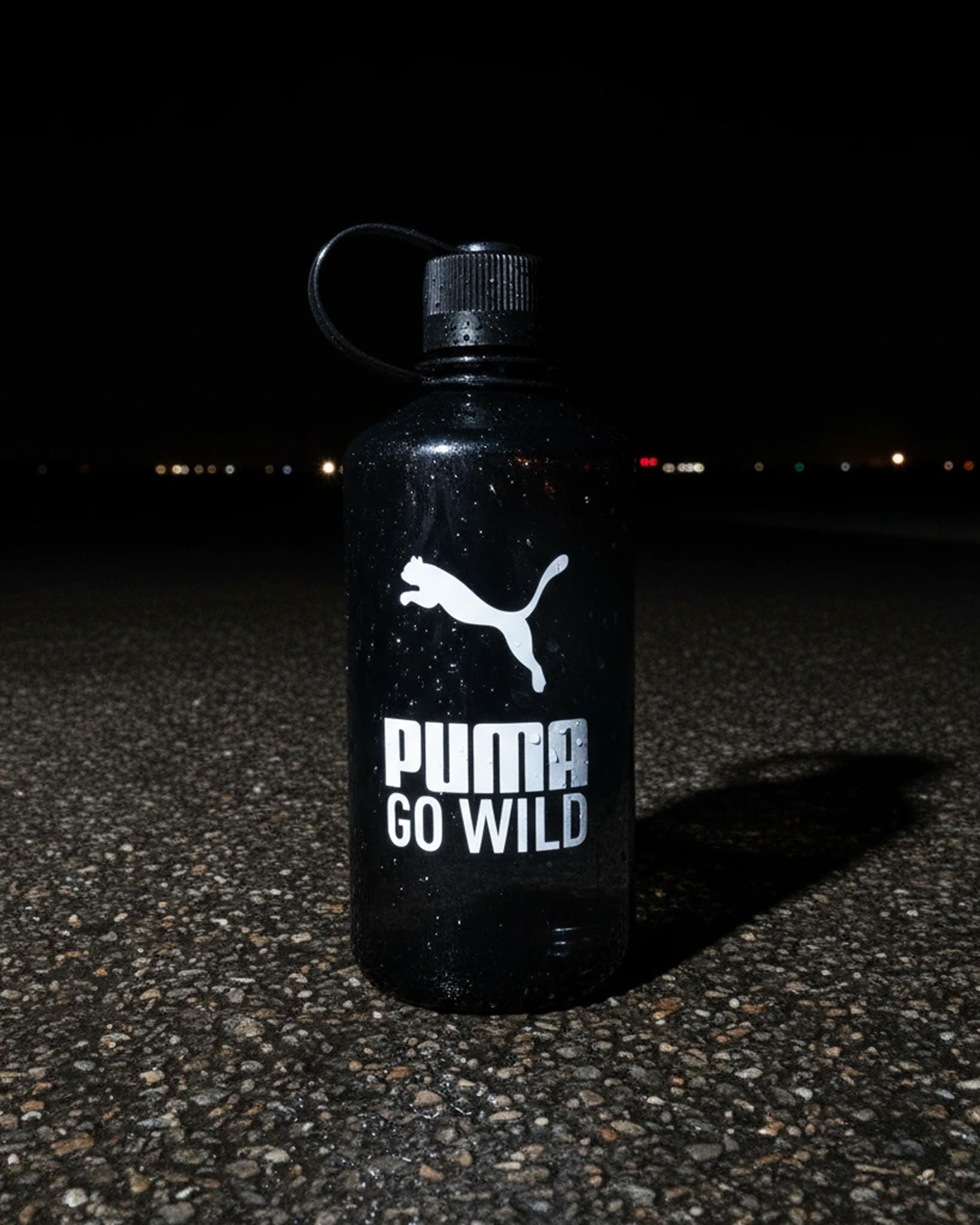 An image of Puma Go Wild photography with the logo on a water bottle as a key visual 